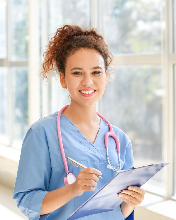 Nurse wrote something on the paper she brought